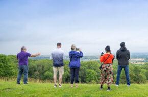 How to be a good tourist with Go Cotswolds. Tourists line up and admire a view in the Cotswolds