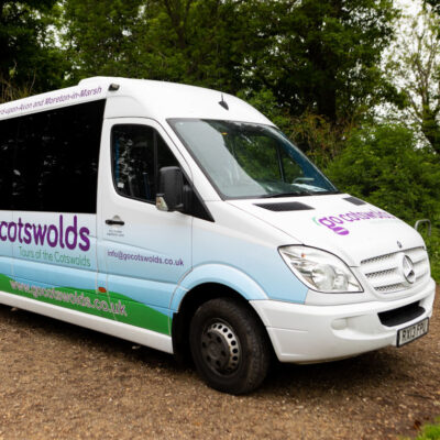 A Go Cotswolds tour bus going to stonehenge