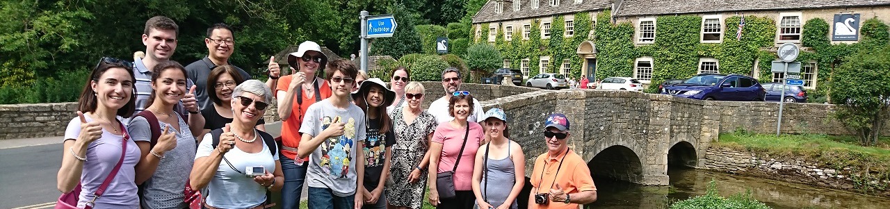 A tour group in Bibury, exploring the Cotswolds from Stratford upon Avon with Go Cotswolds