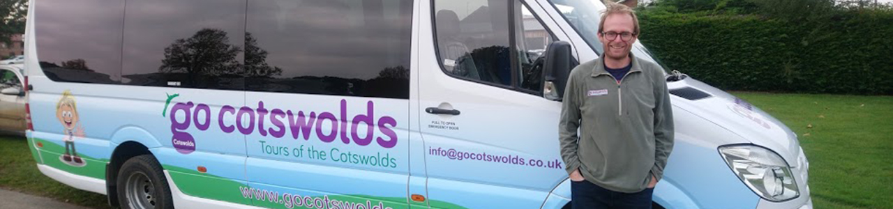 A photo of a Go Cotswolds minibus with Tom, owner of Go Cotswolds from Stratford upon Avon