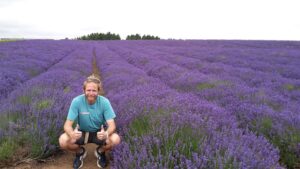 Tom in a lavender field in June on a Go Cotswolds tour