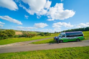 Why visit the Cotswolds in June? Go Cotswolds bus in the beautiful sun.
